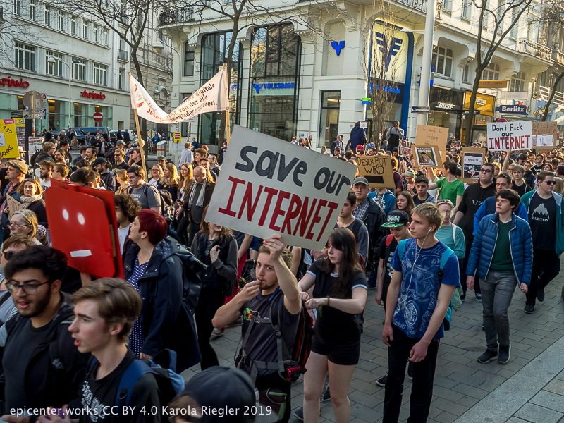 Large crowd marching with a &ldquo;Save our INTERNET&rdquo; sign at the 2019 Vienna protest